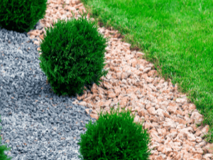 landscaping supplies st catharines - The Benefits of Mulch for Your Garden Beds - a garden border with 2 colors of gravel used as mulch